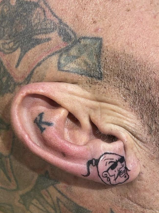 Bikie boss Toby Mitchell’s new earlobe tattoo.