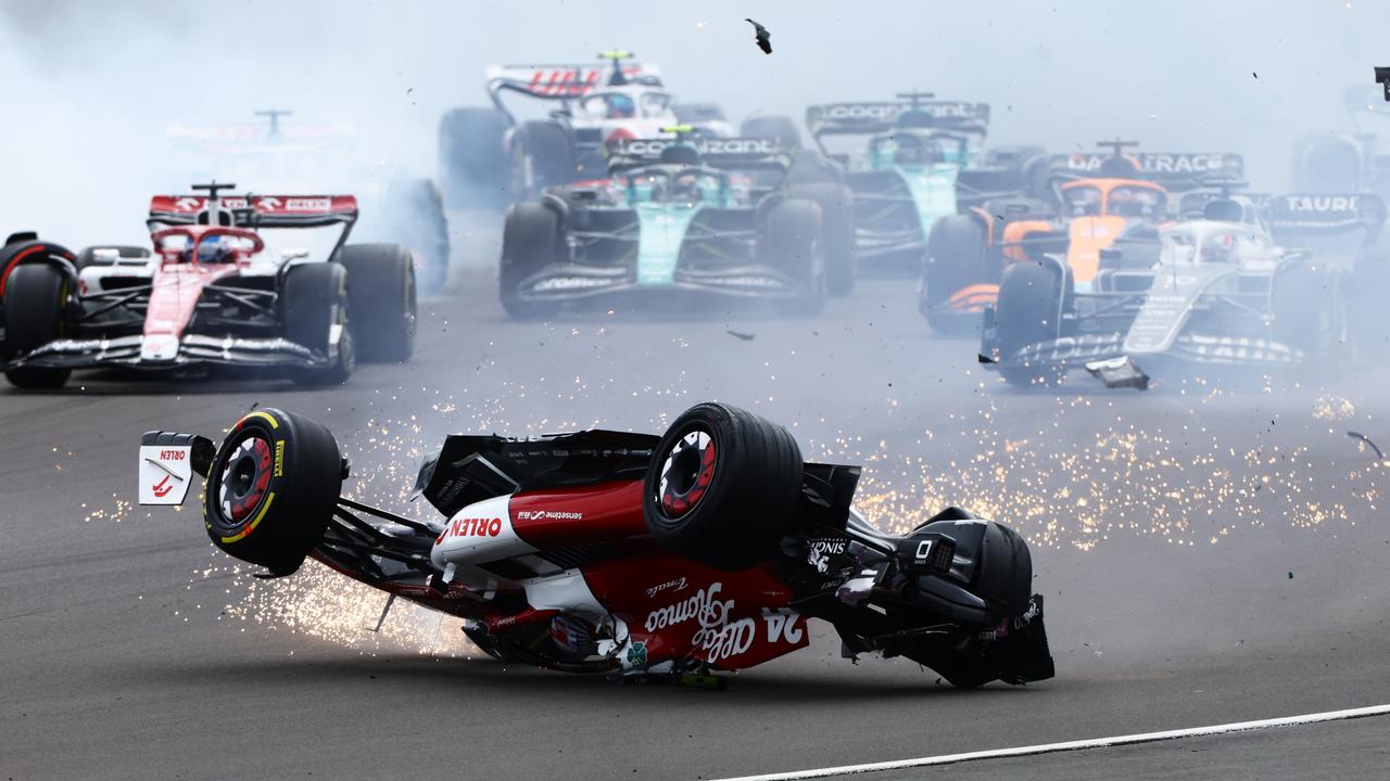 NORTHAMPTON, ENGLAND - JULY 03: Zhou Guanyu of China driving the (24) Alfa Romeo F1 C42 Ferrari crashes at the start during the F1 Grand Prix of Great Britain at Silverstone on July 03, 2022 in Northampton, England. (Photo by Mark Thompson/Getty Images)