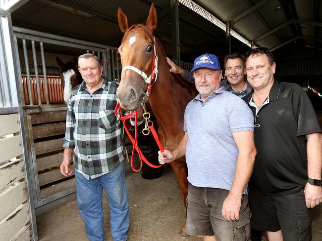 Fred Adams a Gold Coast race horse trainer had $101 chance Steal A Diamond win at the Gold Coast on Wednesday, pictured with the horse and Owners Lance Tuson (cap) , David Jeffries (grey Jacket and Jason Hickson (black shirt) at freds Gold Coast Stables . Picture Mike Batterham