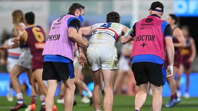 Marcus Bontempelli is helped off the field. Picture: Getty Images