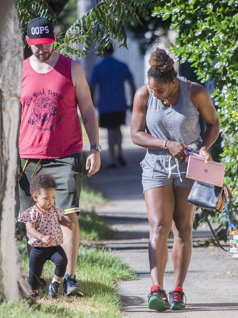 Serena Williams and her husband Alexis Ohanian enjoy an afternoon walk with their 1-year-old daughter Alexia Olympia. Serena's daughter looked seriously cute, toddling her way down the footpath, wearing Nike sneakers like her Mummy. Picture: MediaMode