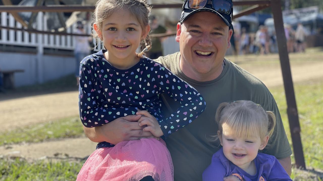 Harriet, Chris, and Lillian Dallas, from Tamworth, enjoy day one of the 2024 Gympie Muster, at the Amamoor State Forest on August 22, 2024.