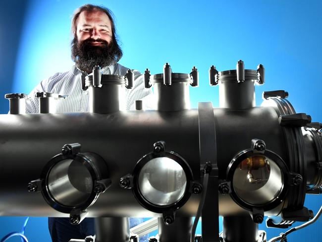 Neumann Space founder Patrick Neumann with his prototype vacuum chamber for a space plasma thruster at his Brompton aerospace lab. Image AAP/Mark Brake