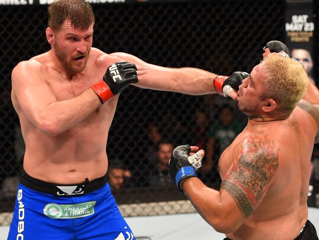 ADELAIDE, AUSTRALIA - MAY 10:   (L-R) Stipe Miocic punches Mark Hunt in their heavyweight bout during the UFC Fight Night event at the Adelaide Entertainment Centre on May 10, 2015 in Adelaide, Australia. (Photo by Josh Hedges/Zuffa LLC/Zuffa LLC via Getty Images)