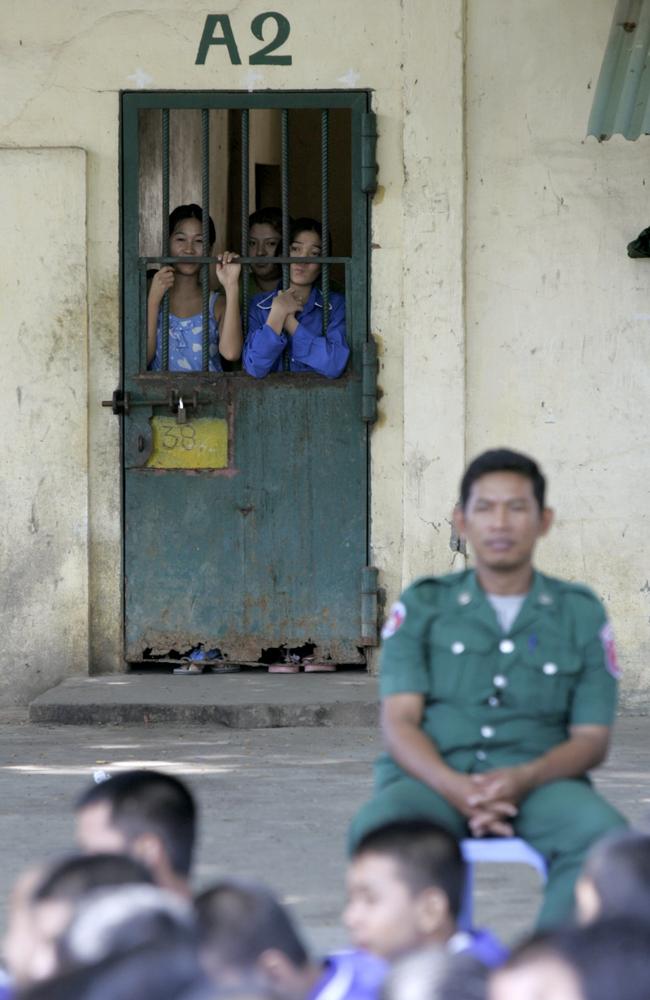 Cambodian prisoners look from their cell in Prey Sar prison. Picture: Reuters