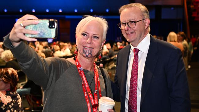 Anthony Albanese poses for a photo with a delegate at the 49th ALP National Conference in Brisbane. He got his way on every policy debate, his role as factional arbiter secure and his overall authority as party leader strengthened. Picture: Dan Peled/NCA NewsWire
