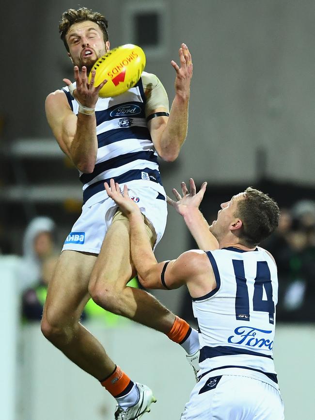 Geelong’s Jordan Murdoch marks over the top of teammate Joel Selwood. Picture: Getty Images