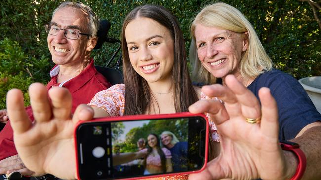 Proud mum and dad Carolyn and Lukas Tsakalos with daughter Jacinda, who studied by his bedside as he recovered from a horrific car accident. Picture: Matt Loxton