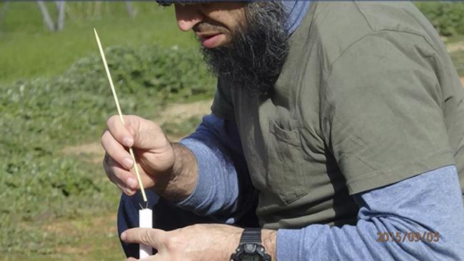 Convicted terrorist Haisem Zahab preparing a test rocket for launch at his Young property.