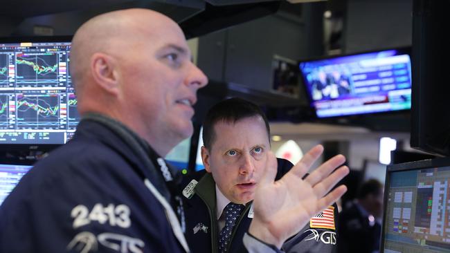 Traders work on the floor of the New York Stock Exchange. (Spencer Platt/Getty Images/AFP)