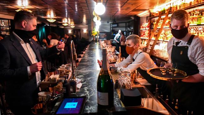 Patrons enjoy a drink in Nick &amp; Nora's bar at a midnight opening in Melbourne on October 28. Picture: supplied.