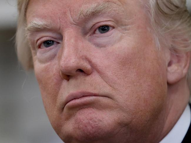 WASHINGTON, DC - OCTOBER 10: U.S. President Donald Trump answers questions from the press during a meeting with former U.S. Secretary of State Henry Kissinger in the Oval Office October 10, 2017 in Washington, DC. Trump answered a range of questions during the portion of the meeting that was open to the press, including queries on Secretary of State Rex Tillerson.   Win McNamee/Getty Images/AFP == FOR NEWSPAPERS, INTERNET, TELCOS & TELEVISION USE ONLY ==