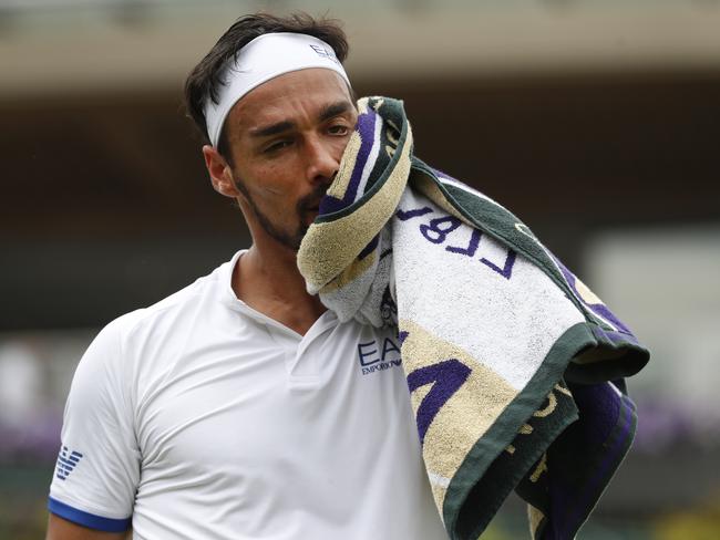 Italy's Fabio Fognini wipes his face as he plays United States' Tennys Sandgren in a Men's singles match during day six of the Wimbledon Tennis Championships in London, Saturday, July 6, 2019. (AP Photo/Alastair Grant)