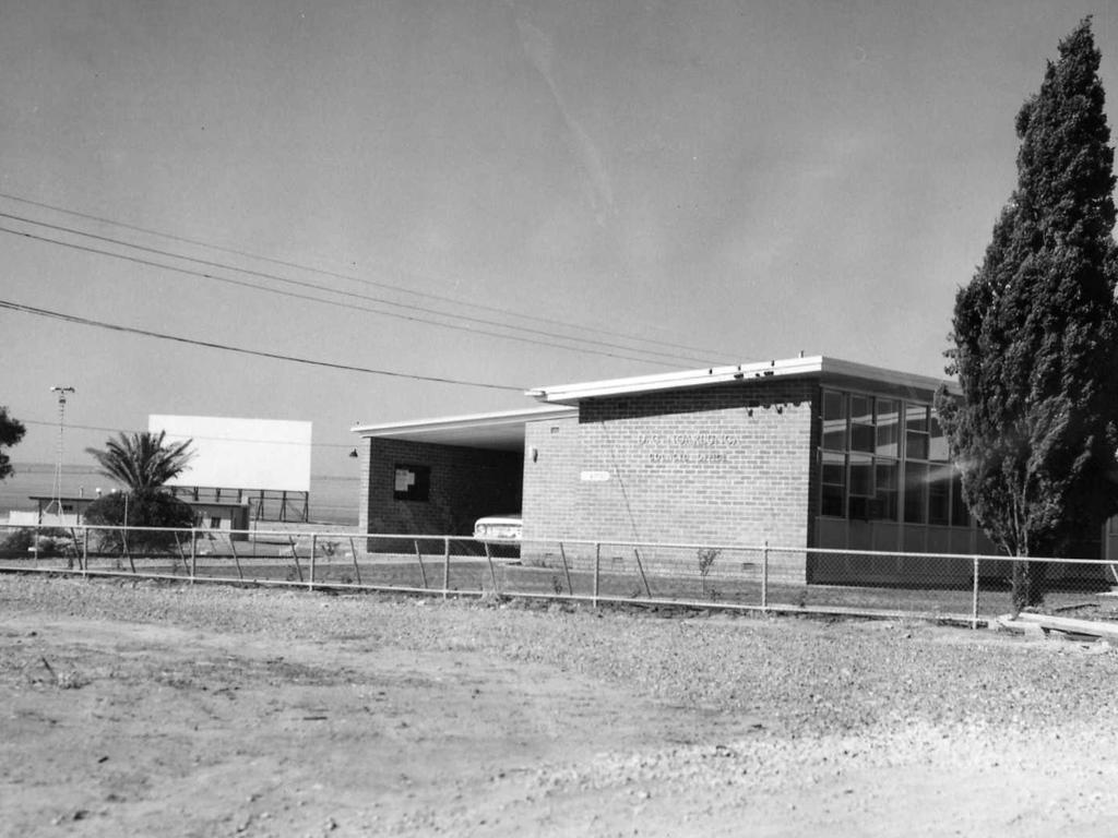 District Council offices at Christies Beach with a drive-in theatre in the background, October 1961. Picture: Harry Collier