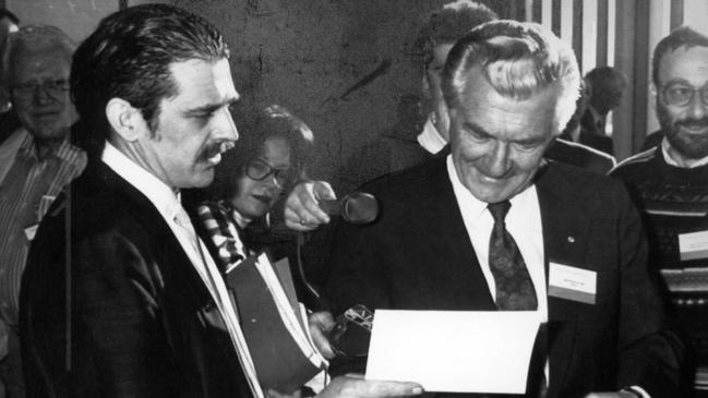 1991. Prime Minister Bob Hawke is served with a summons by anti-war protester Barry Jessup, of Launceston, at the ALP Conference in Hobart. Picture: Leigh Winburn