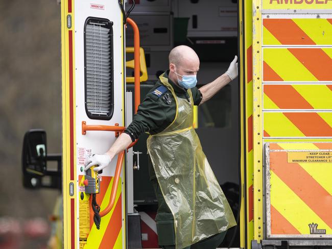 A paramedic is seen in the back of an ambulance outside St Thomas’ hospital in London. COVID-19 deaths in the UK continue to soar. Picture: Getty Images