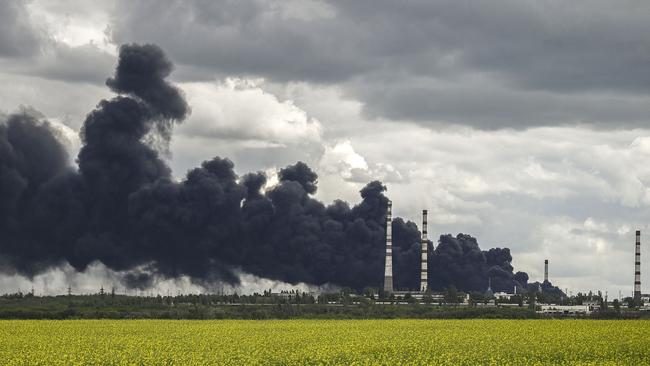 Smoke rises from an oil refinery after an attack outside the city of Lysychansâk in the eastern Ukranian region of Donbas. Picture: AFP.