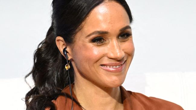 American actress Meghan Markle smiles during the 'Responsible Digital Future' forum in Bogota on August 15, 2024. Prince Harry and his wife, American actress Meghan Markle, arrived in Colombia at the invitation of Marquez, with whom they will attend various meetings with women and young people to reject discrimination and cyberbullying. (Photo by Raul ARBOLEDA / AFP)