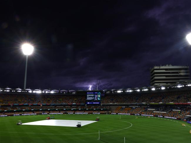 A general view of storm clouds rolling over The Gabba. Picture: Pat HOELSCHER / AFP
