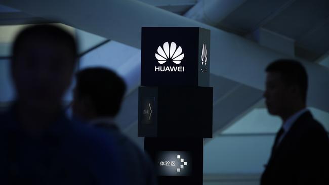 Visitors attend a launch event for the Huawei MateBook in Beijing. Picture: AP