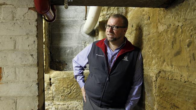 Pete Smith, Director of Heritage Tasmania below the offices at 103 Macquarie Street in a mid 19th century basement.