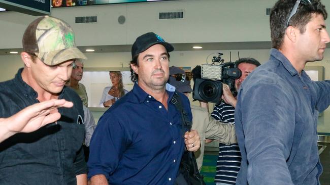 Matt Wright arrives in Darwin flanked by security to present himself to NT Police to face charges relating to the fatal accident that killed his friend and co-star Chris ‘Willow’ Wilson in February 2022. Picture: Glenn Campbell