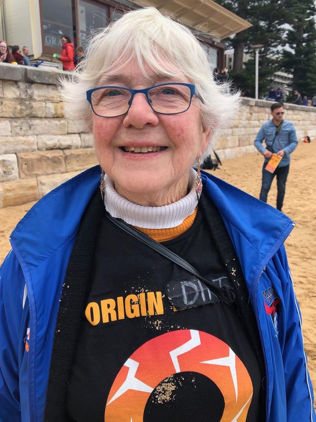 Keelah Lam, 76, of Fairlight at the Extinction Rebellion protest at Manly, where activists put their heads in the sand. Picture: Julie Cross