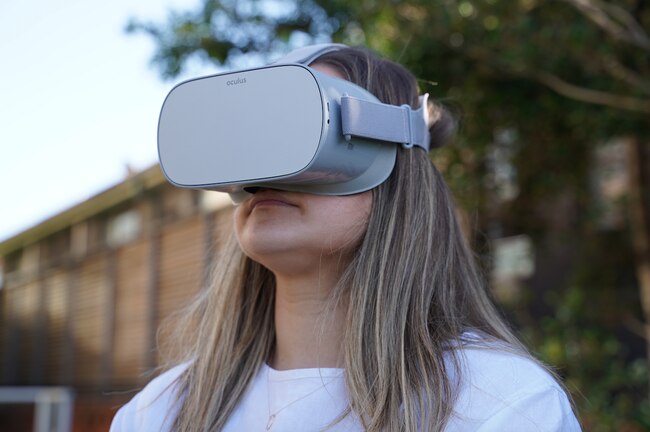 Woman using a VR headset VR 360 degree immersive real estate inspection. Picture: Supplied