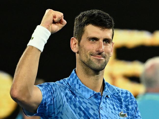 Serbia's Novak Djokovic celebrates victory against Australia's Alex De Minaur during their men's singles match on day eight of the Australian Open tennis tournament in Melbourne on January 23, 2023. (Photo by MANAN VATSYAYANA / AFP) / -- IMAGE RESTRICTED TO EDITORIAL USE - STRICTLY NO COMMERCIAL USE --