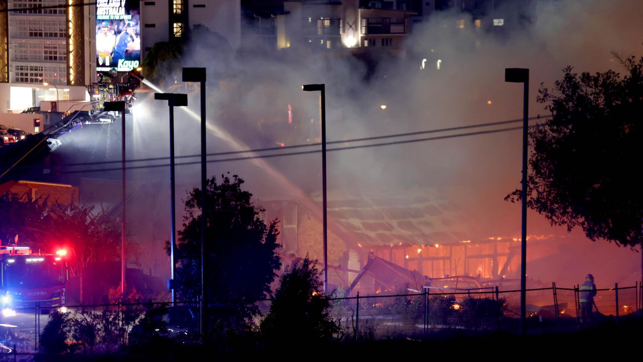 Multiple fire units spray water on buildings on fire in Hubert St. Photo: Steve Pohlner