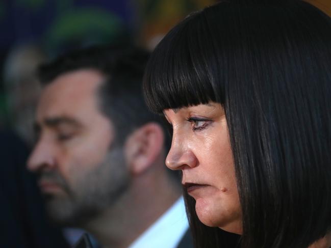 Rugby Australia CEO Raelene Castle (right) reacts with NSW Waratahs CEO Andrew Hore (left) as they listen to questions during a media conference regarding the Code of Conduct hearing of Wallabies star Israel Folau at Rugby Australia headquarters in Sydney, Friday, May 17, 2019. (AAP Image/David Gray) NO ARCHIVING