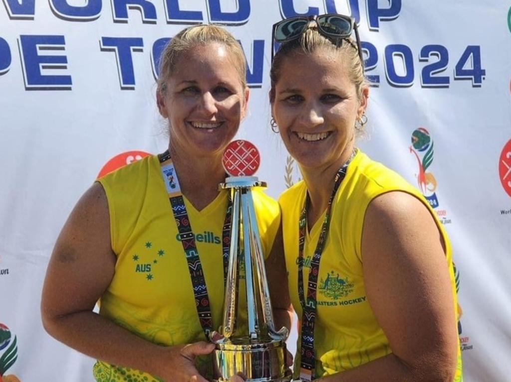 Sisters Kim Reibel and Toni Chirio with the cherished Masters World Cup trophy.