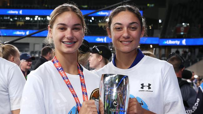 Sydney FC gun Indiana Dos Santos and Jynaya Dos Santos with the A-League Grand Final trophy after their victory over Western United.