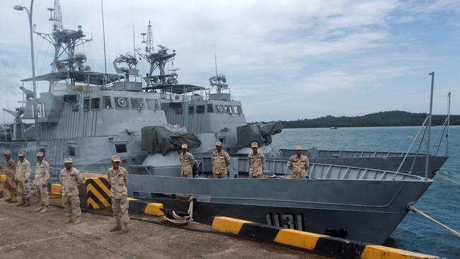 Sailors guard patrol boats at the Cambodian Ream naval base in Sihanoukville, Cambodia. Picture: Reuters.