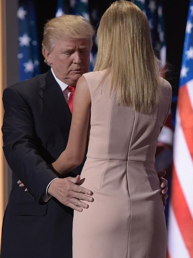 Donald Trump gets up close (like, really close) and personal with Ivanka. (Pic: AFP/Brendan Smialowski)