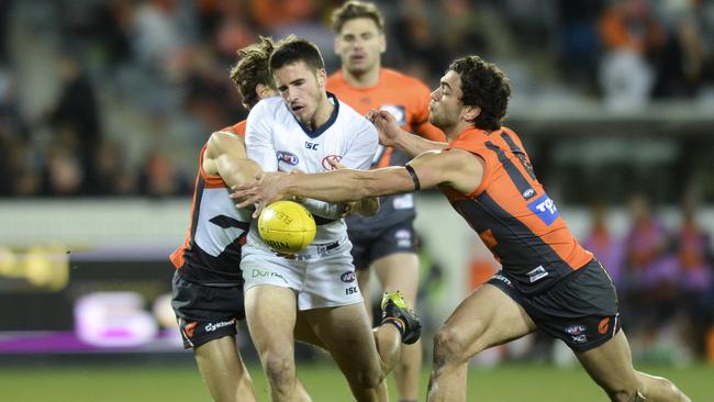 Crows young gun Lachlan Murphy runs into some congestion against the Giants on Saturday. Picture: AAP Image/Rohan Thomson