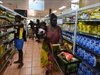 Indigenous Australians shopping at the general store