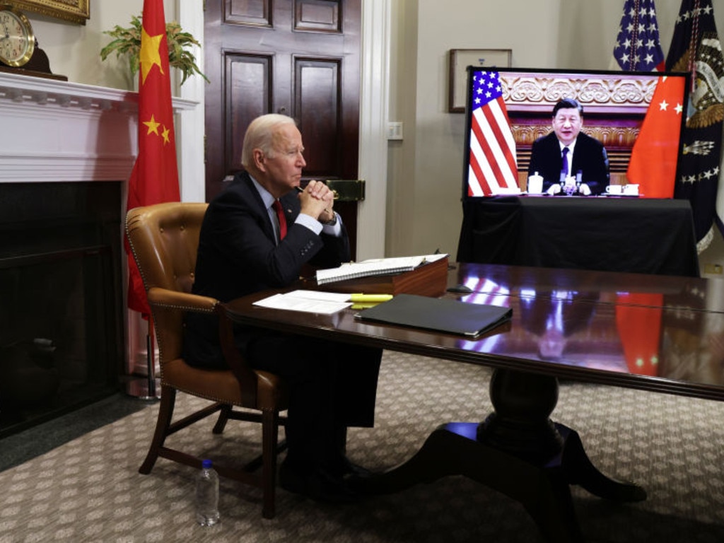 US President Joe Biden participates in a virtual meeting with Chinese President Xi Jinping at the White House.