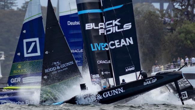 New Zealand SailGP Team helmed by Peter Burling nosedive beside Germany SailGP Team presented by Deutsche Bank helmed by Erik Heil on Race Day 1 of the KPMG Australia Sail Grand Prix in Sydney, Australia. Saturday 8 February 2025. Rolex SailGP Championship Event 3 Season 2025. Photo: Felix Diemer for SailGP. Handout image supplied by SailGP