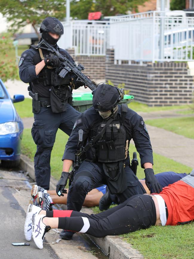 The dramatic arrests unfold on the South Wentworthville property where an unlicensed .38 calibre gun was found. Picture: NSW Police