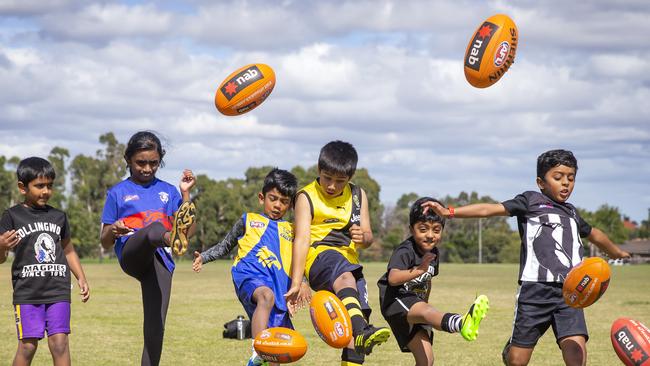 Kids from the Indian communituy are getting into footy. From left, Murari, 6, Manasi, 9, Vihaan, 6, Tanish, 9, Aditya, 6 and Sanjay, 8. Picture: Sarah Matray