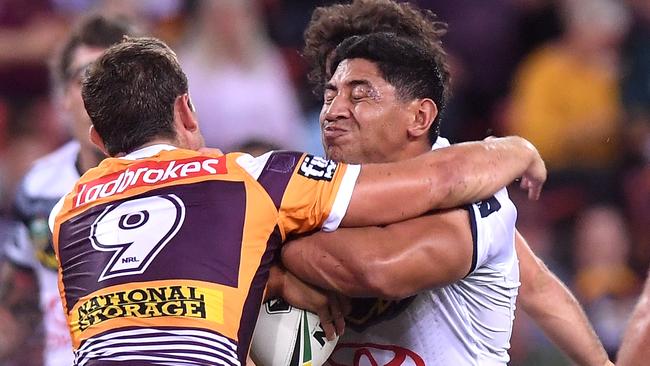 BRISBANE, AUSTRALIA — MARCH 16: Jason Taumalolo of the Cowboys takes on the defence during the round two NRL match between the Brisbane Broncos and the North Queensland Cowboys at Suncorp Stadium on March 16, 2018 in Brisbane, Australia. (Photo by Bradley Kanaris/Getty Images)