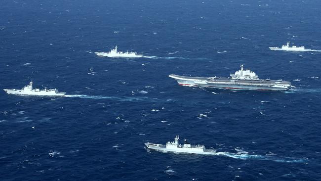 This aerial photo taken on January 2, 2017 shows a Chinese navy formation, including the aircraft carrier Liaoning during military drills in the South China Sea. China’s presence in the Indian Ocean is also growing. Picture: AFP