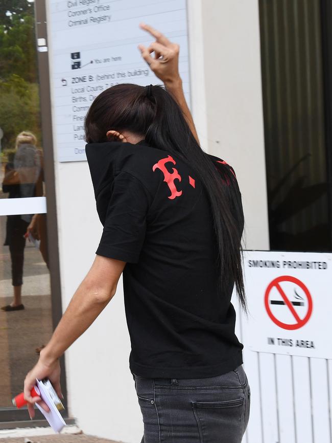 Skylie Ann Monck flips the bird as she leaves court