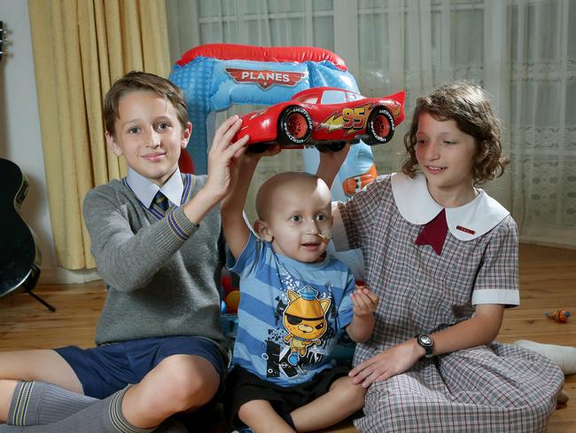 Luke, Nicholas and Charlotte Forwood at home. Picture: ADAM WARD