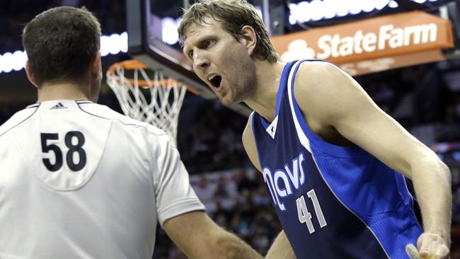 Dallas Mavericks forward Dirk Nowitzki complains to referee Josh Tiven.