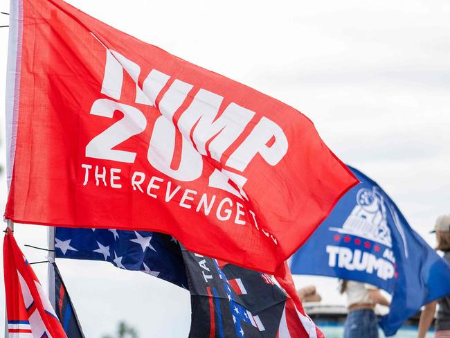 Supporters of US President-elect Donald Trump gether with hundreds of decorated cars and trucks during a Trump Victory Parade in West Palm Beach, Florida, on November 17, 2024. (Photo by Jim WATSON / AFP)