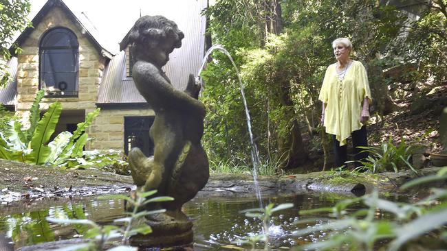 Jeanne Villani in her garden at Waterfall Cottage.