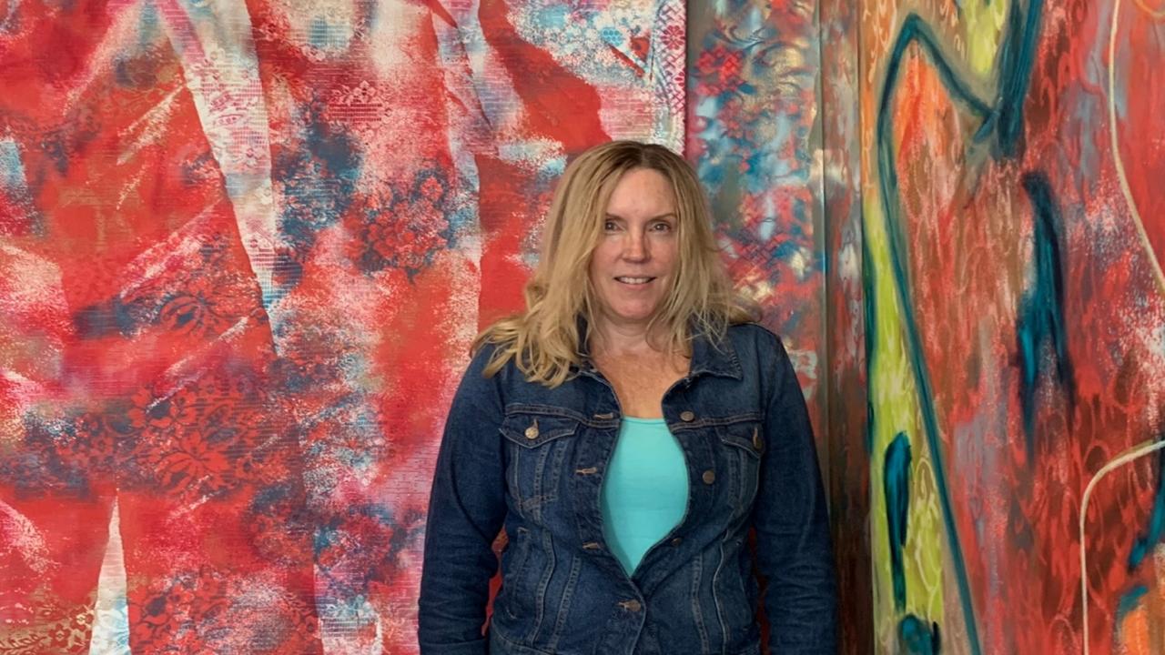 Cathy Condon in front of her painting 'Red Jacket'. Picture: supplied.