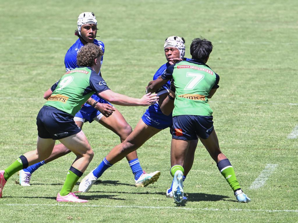 Mikal Papalii-Talanai is tackled by Joaz Ayamiseba. Picture: Martin Ollman